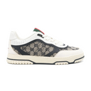Beige and blue canvas low-top sneakers with rubber sole, side profile