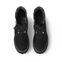 Model sitting in jeans wearing black LV Timberland boots