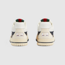 Back view of cream sneakers with padded heel and contrasting outsole