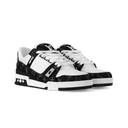 Pair of black and white sneakers with contrast sole and denim upper design