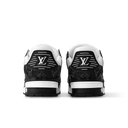 Rear view of black and white sneakers with padded heel and graphic sole trim